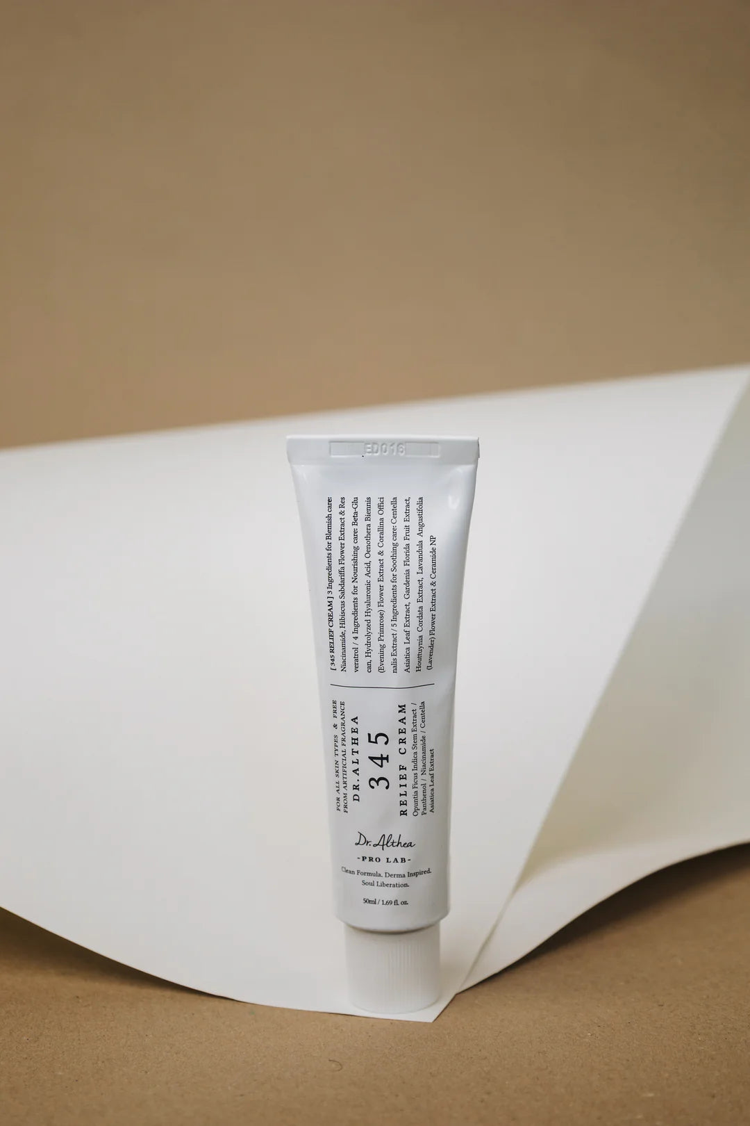Nuaglow Lenas rutine skincare products arranged on a clean surface with soft lighting.