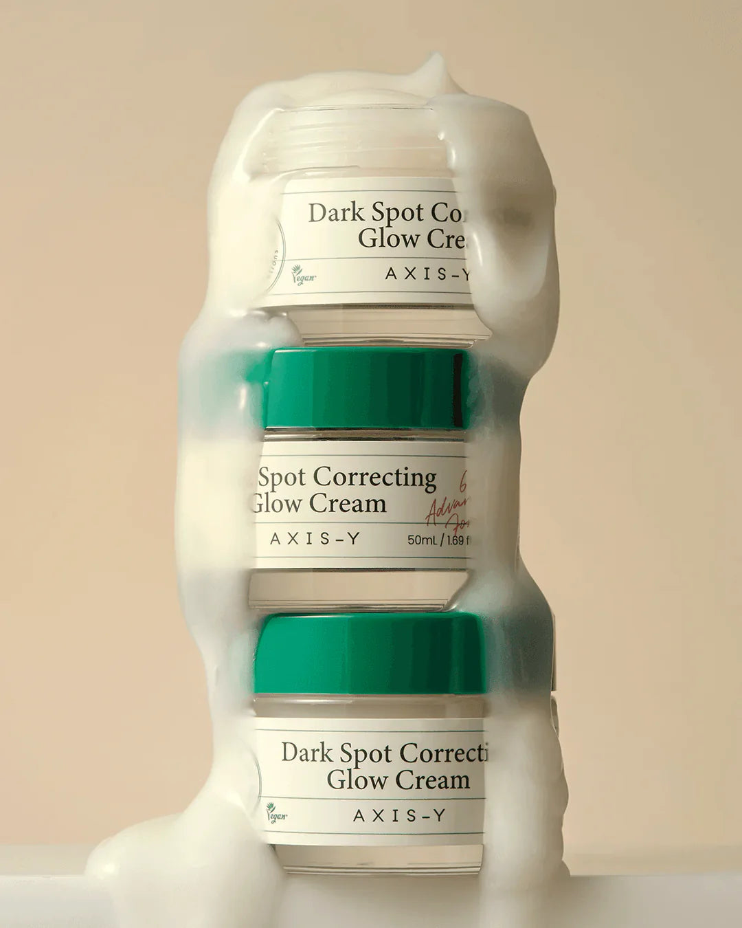 Nuaglow skincare routine featuring AXIS-Y Dark Spot Correcting Glow Cream in a sleek container on a light background.