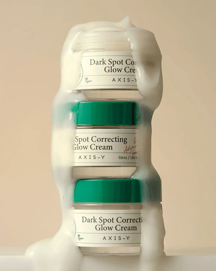 Nuaglow skincare routine featuring AXIS-Y Dark Spot Correcting Glow Cream in a sleek container on a light background.