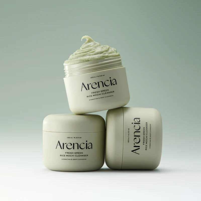 Arencia Fresh Green Rice Mochi Cleanser in a clear bottle, showcasing its vibrant green rice-based liquid for gentle facial cleansing.