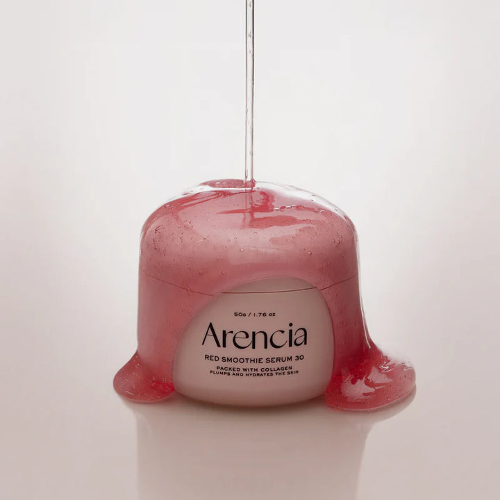 Arencia Red Smoothie Serum 30 in a clear glass bottle with a pump dispenser, featuring vibrant red fruit imagery on the label.