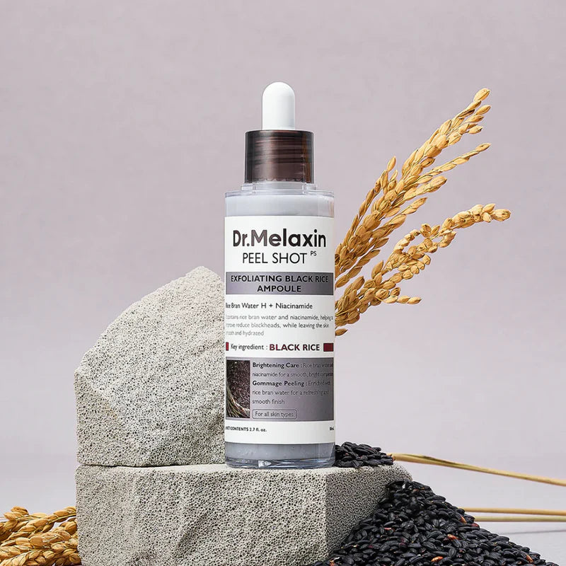 Dr. Melaxin Black Rice Peel Shot Exfoliating Serum in 80ml bottle, featuring black rice extract for skin renewal and brightening.