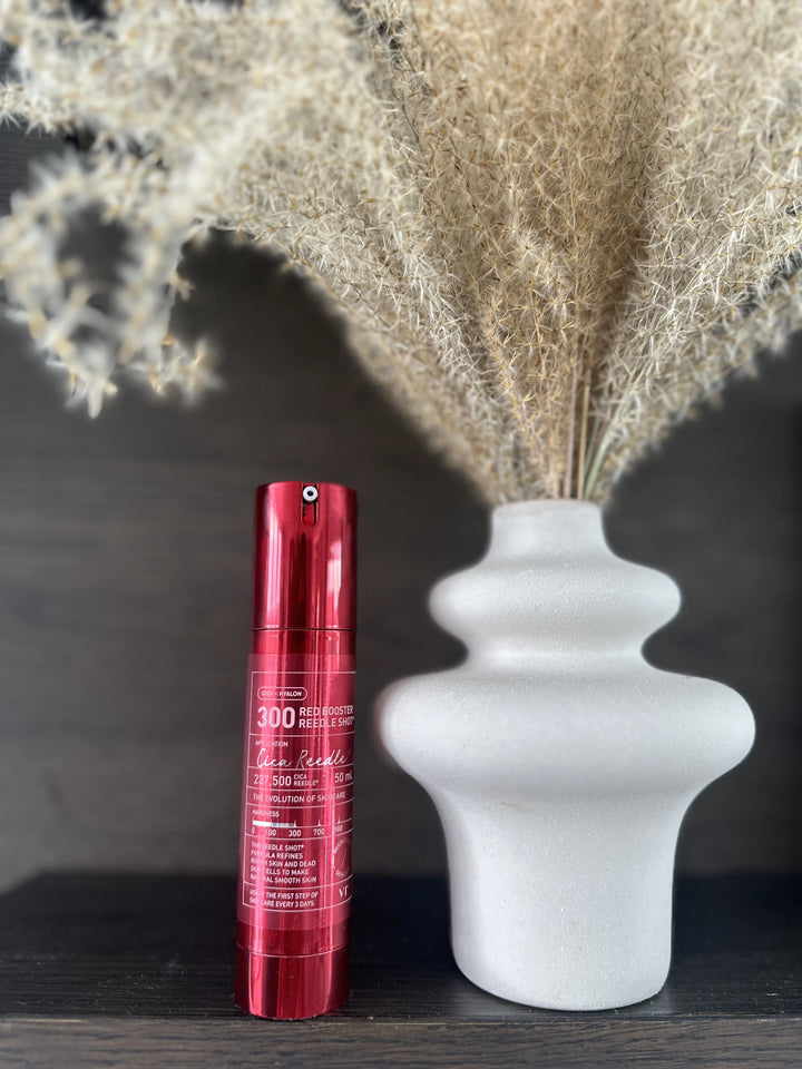 VT Cosmetics Red Booster Reedle Shot serum in a 50ml bottle with a vibrant red design and dropper cap.
