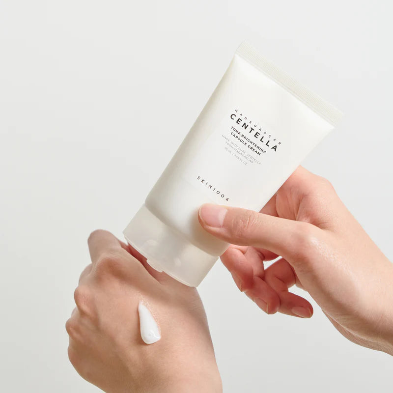 SKIN1004 Madagascar Centella Tone Brightening Capsule Cream in a 75ml jar, shown with the cream and packaging.