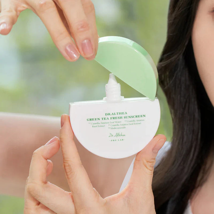 Nuaglow calming skincare routine with Dr. Althea Green Sunscreen for redness relief, featuring skincare products in a clean setting.