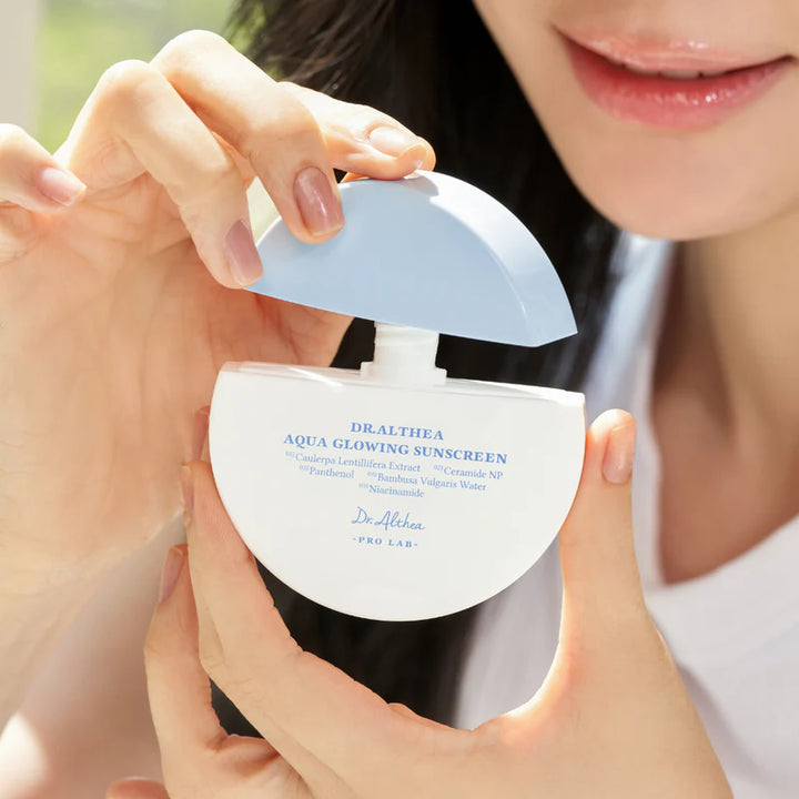 Dr. Althea Aqua Glowing Sunscreen 45ml, a blue-tinted sun protection cream with hydrating and glowing skin benefits.
