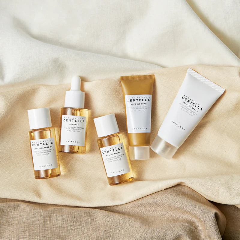 SKIN1004 Madagascar Centella travel kit with 170ml skincare bottles featuring natural ingredients and compact packaging for travel.